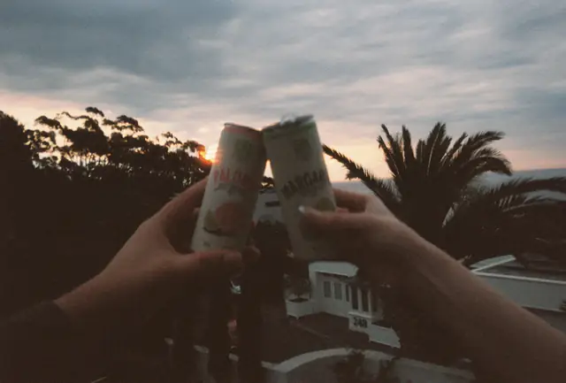 Two cans, clinked